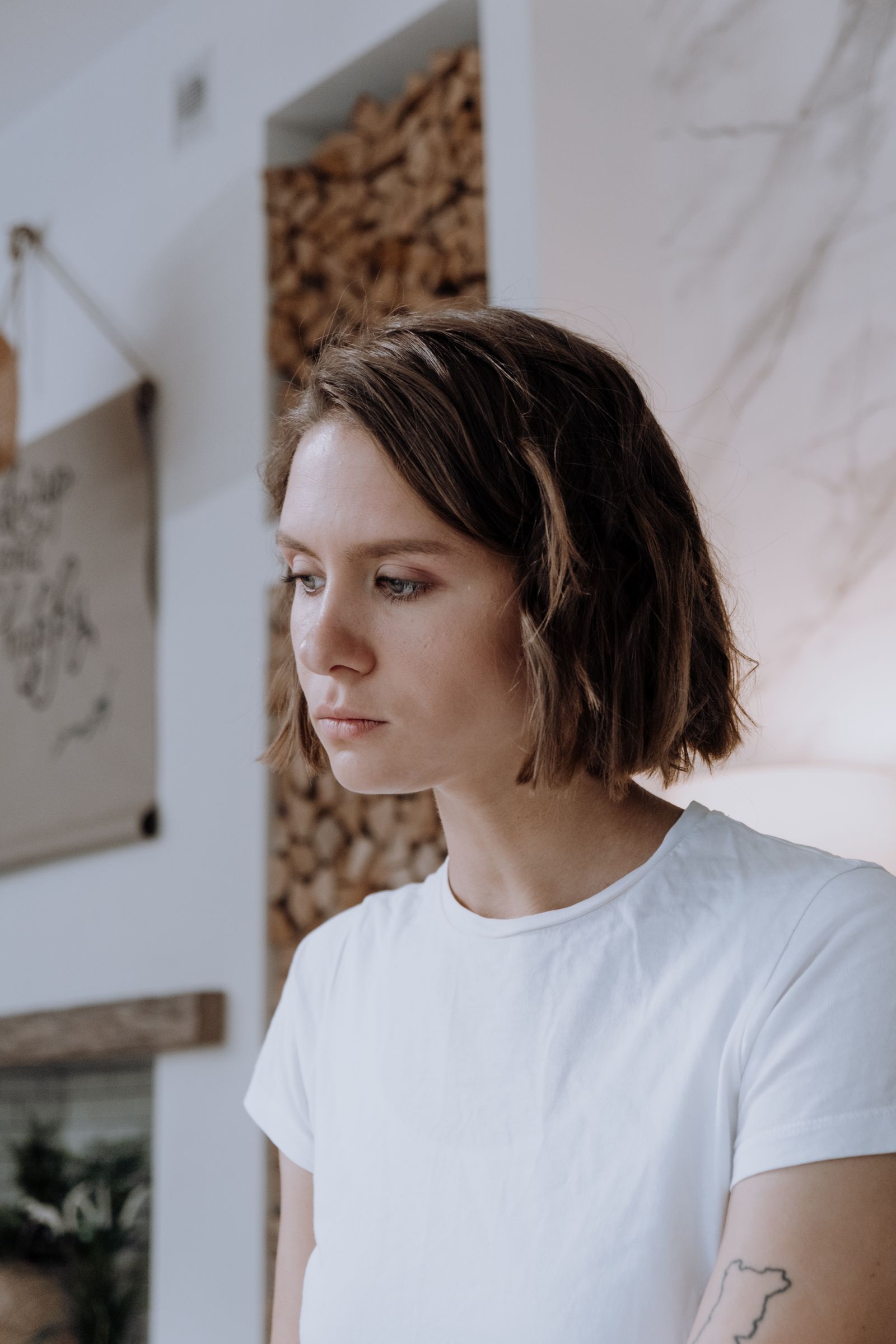15 Elegant Italian Bob Haircut Ideas for a Sophisticated Look Portrait of a young woman with a bob haircut wearing a white t-shirt indoors