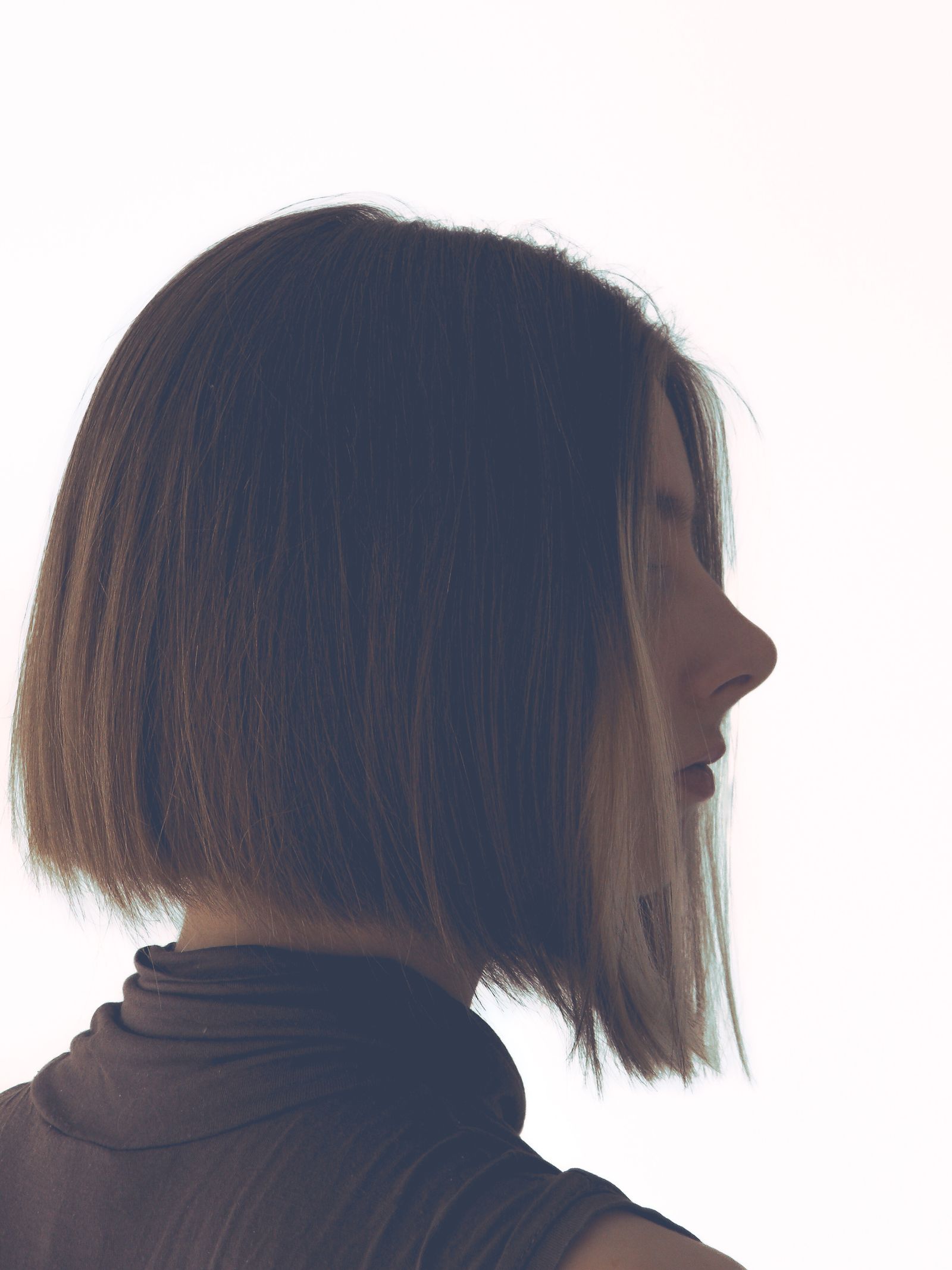 15 Elegant Italian Bob Haircut Ideas for a Sophisticated Look Silhouette profile of a woman with a bob haircut