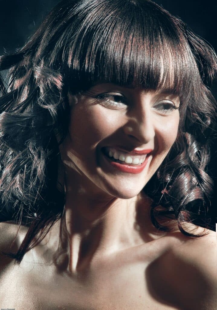 15 Curtain Bangs for Round Faces That Actually Flatter Curtain bangs with loose curls for round faces