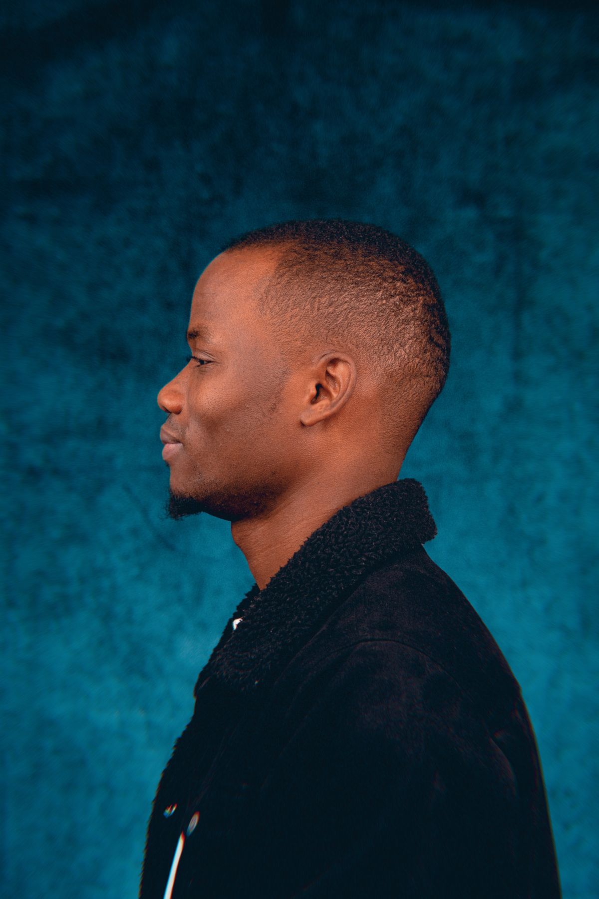 15 Sharp Haircuts for Black Men (2026 Guide) Buzz cut with beard blend — haircuts for black men