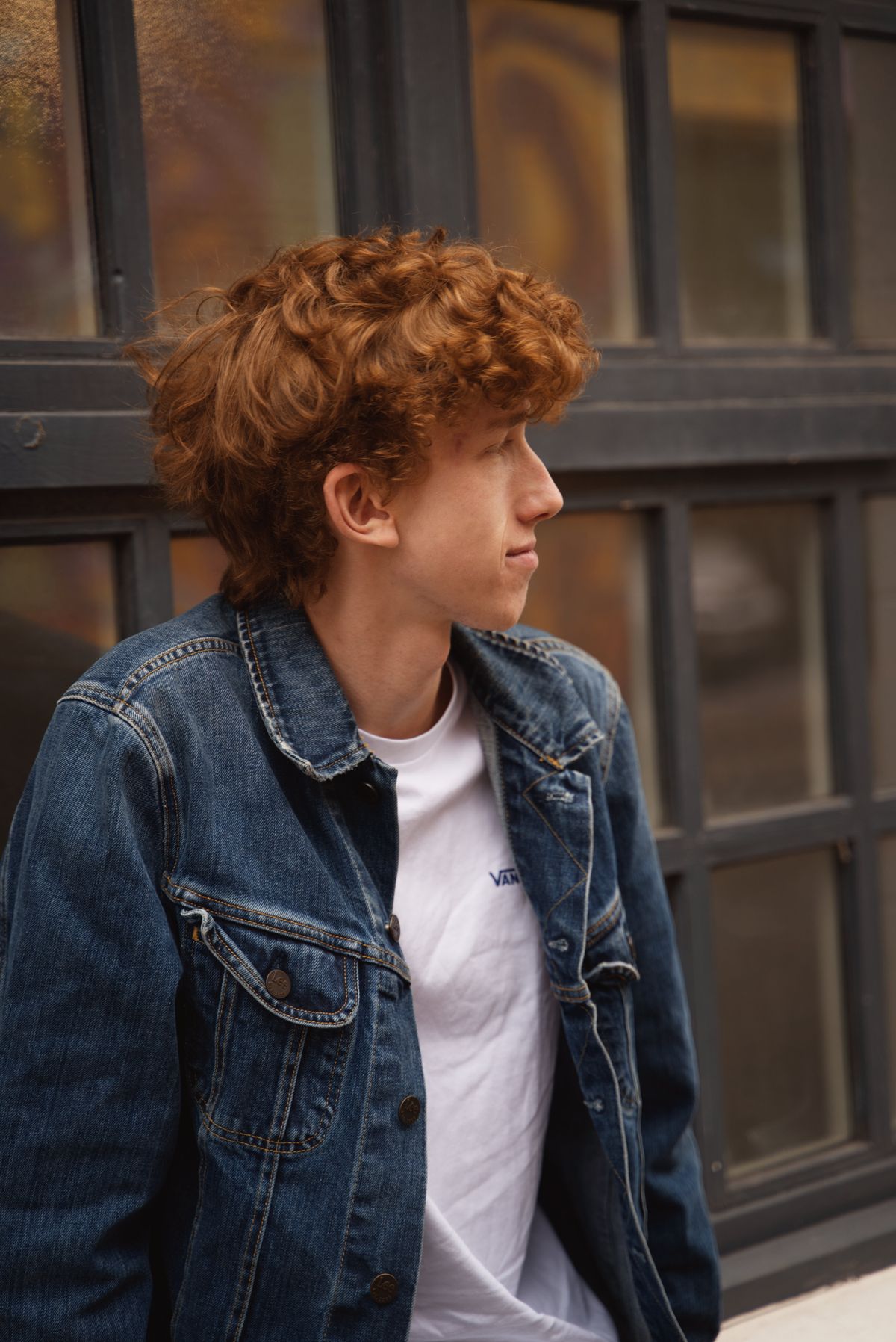 15 Cool Haircuts for Boys (2026 Guide for Every Age) Curly broccoli-style haircut for teen boys