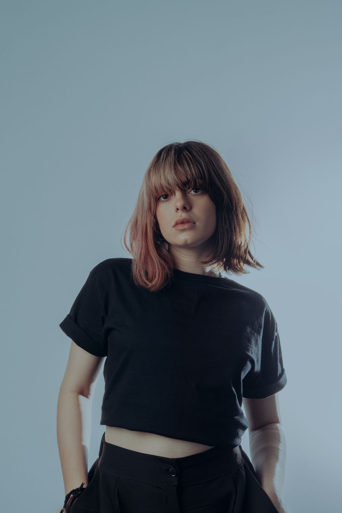 18 Best Haircuts for Round Faces That Slim and Flatter (2026 Guide) Side-swept bangs for round faces
