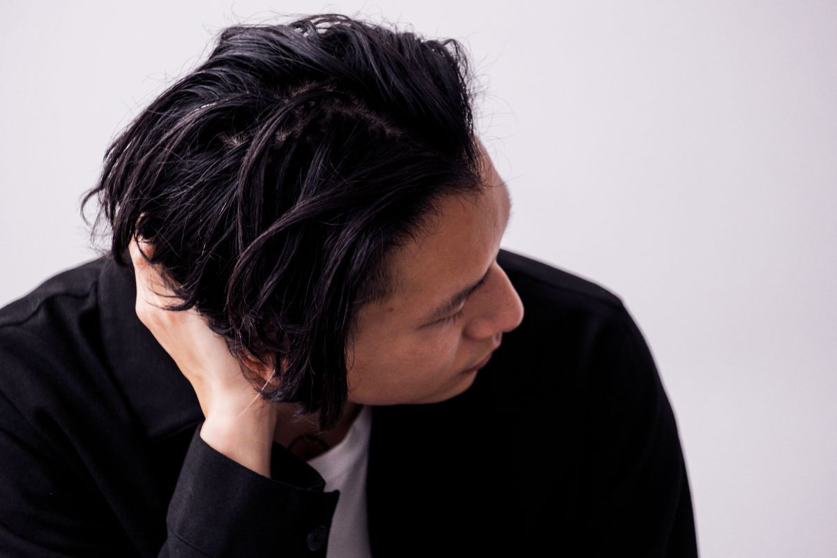 16 Trendy Asian Men Hairstyles (2026 Guide) Long textured hairstyle for asian men — middle-part flow