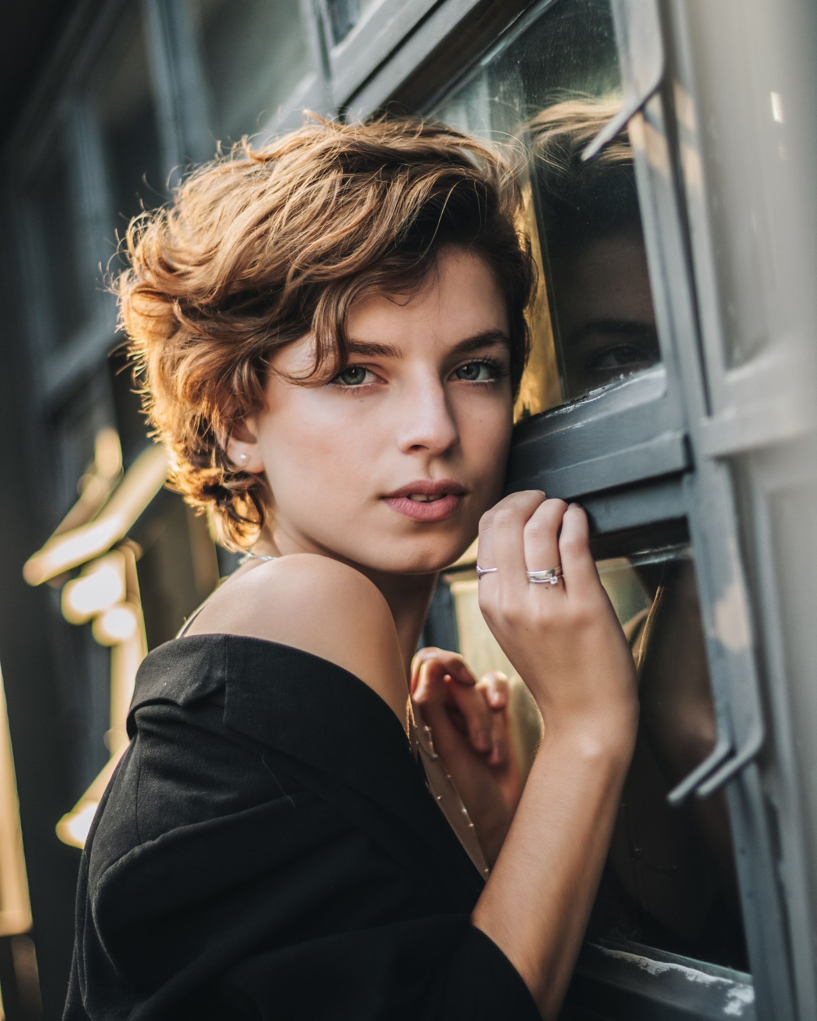 15 Trendy Bixie Haircut Ideas You Need to Try in 2026 Portrait of a young woman with a short bixie bob haircut wearing a black coat