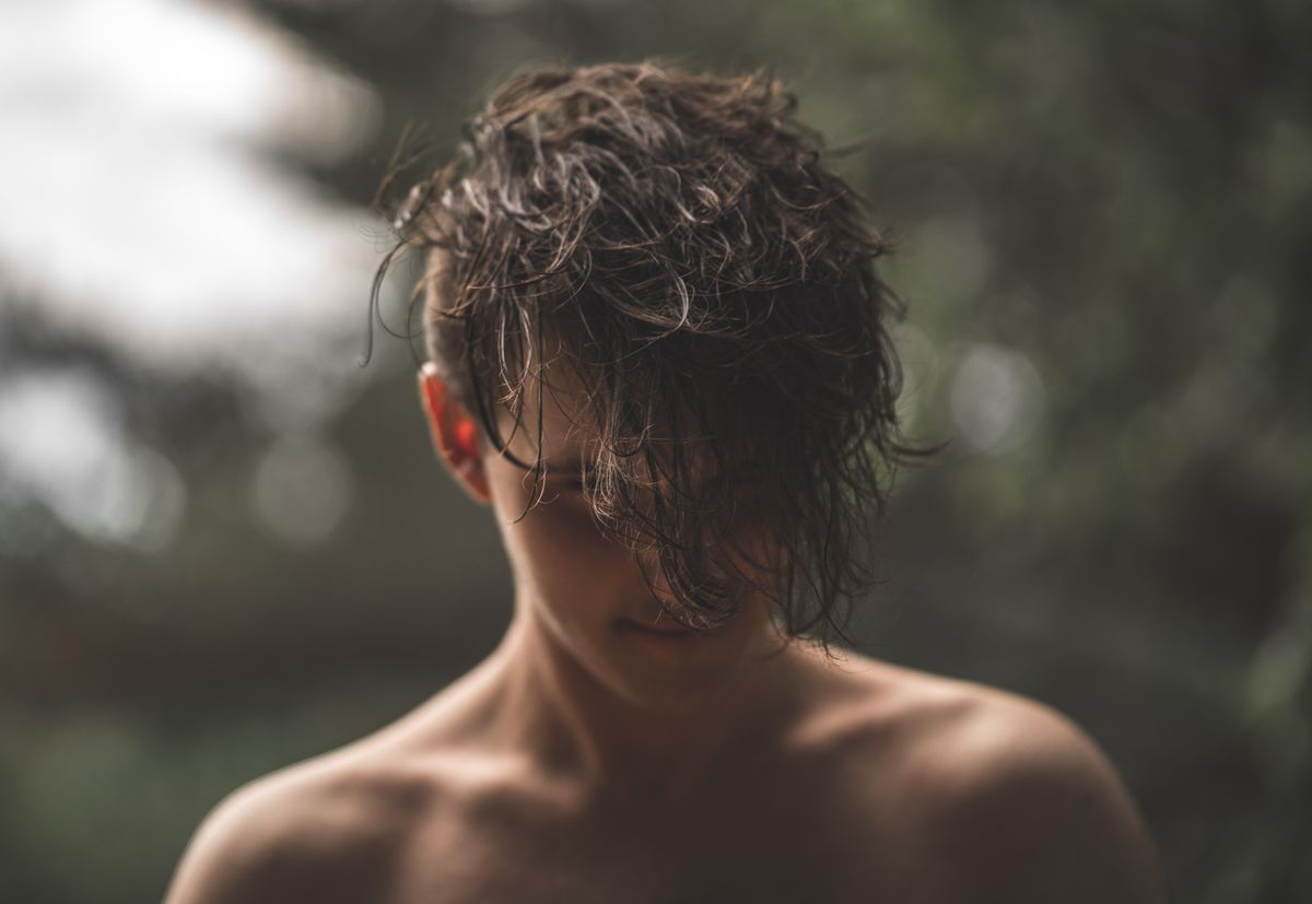 15 Cool Haircuts for Boys (2026 Guide for Every Age) Side-swept fringe haircut for boys