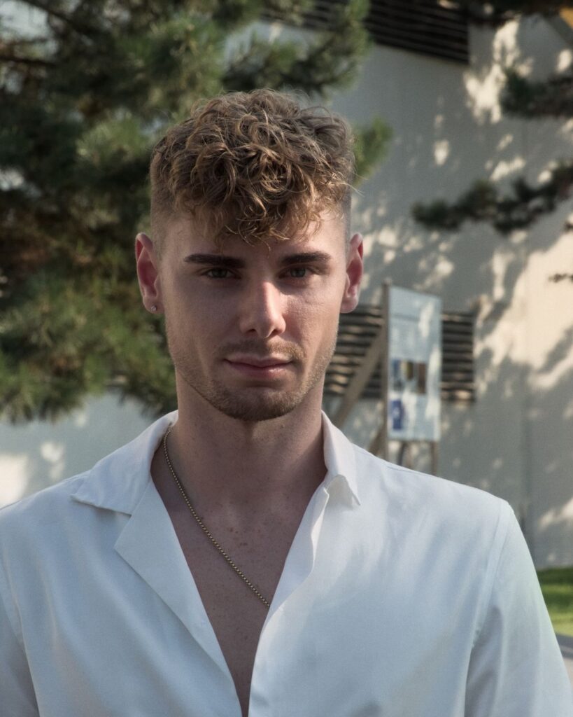 15 Latest Men's Hairstyles Trending in 2026 Curly textured top haircut for men — 2026 trends
