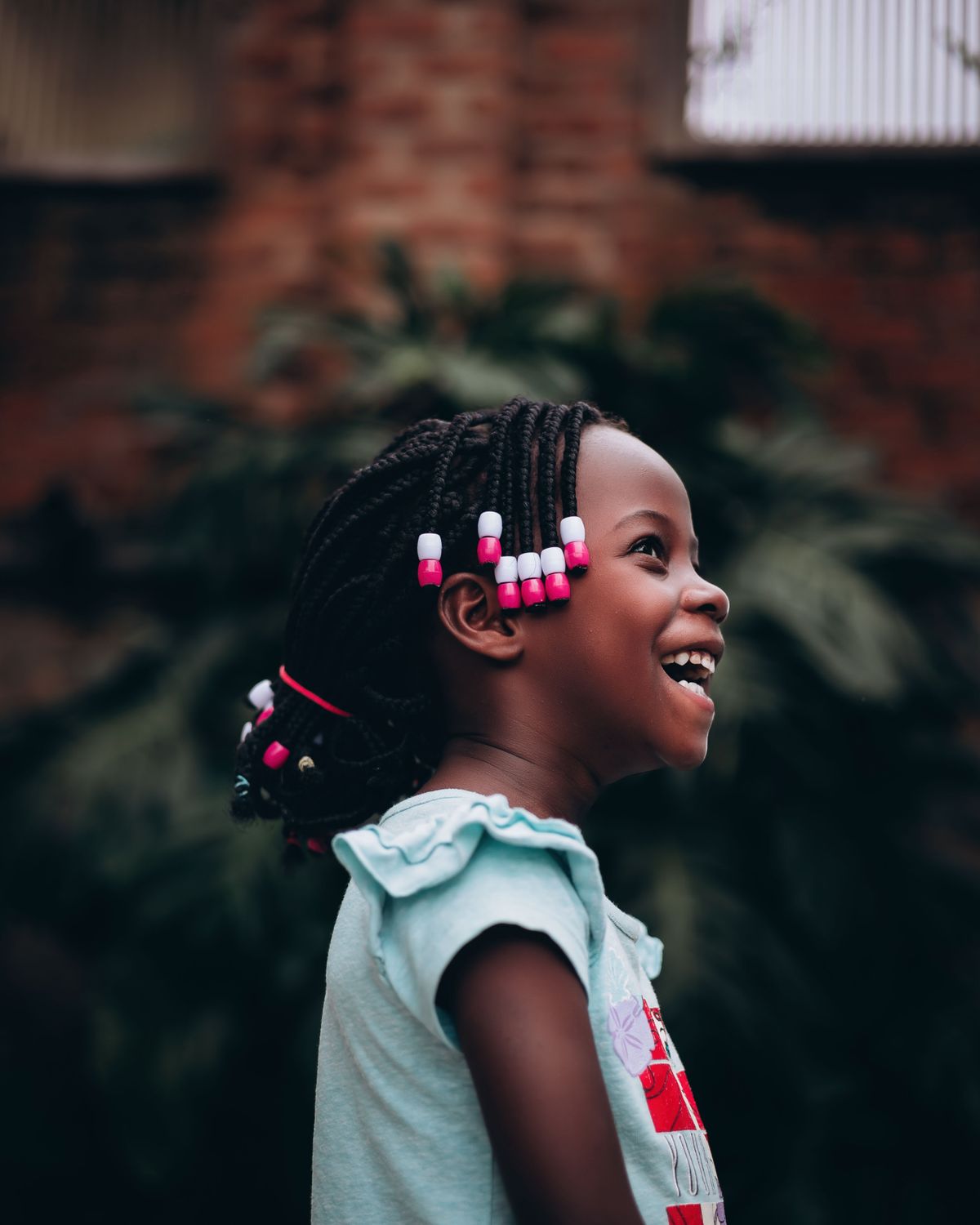 14 Cute Braided Hairstyles for Kids (Easy Enough for Busy Mornings) Cornrows with beads — braided hairstyles for kids