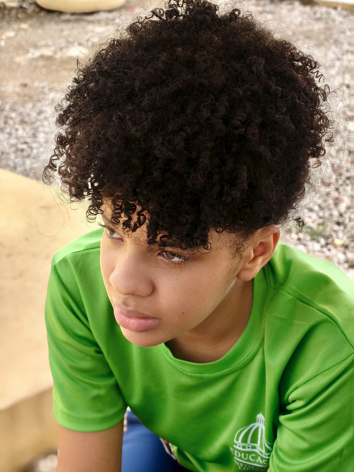 15 Cool Haircuts for Boys (2026 Guide for Every Age) Curly top haircut for boys with curly hair