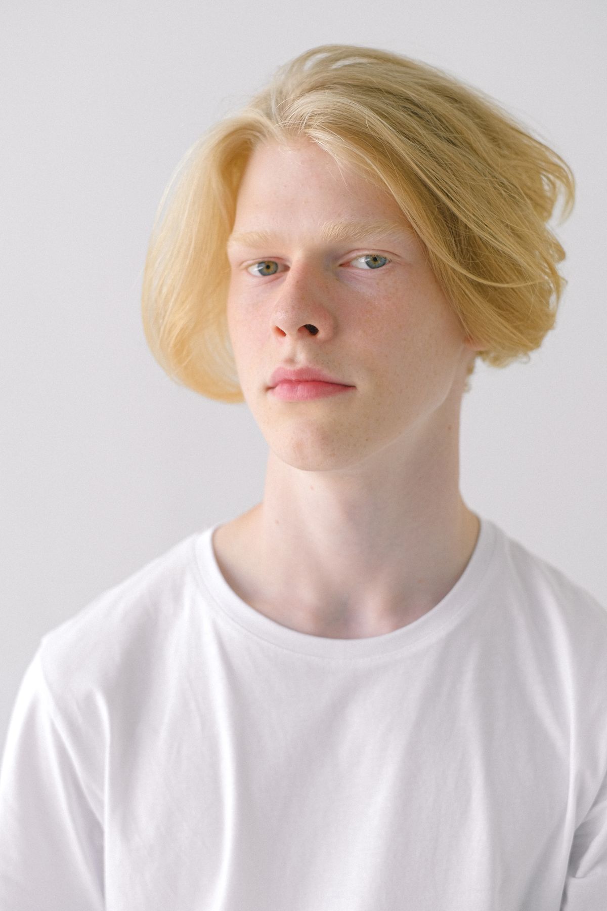 15 Cool Haircuts for Boys (2026 Guide for Every Age) Curtain haircut for teen boys — cool haircuts for boys