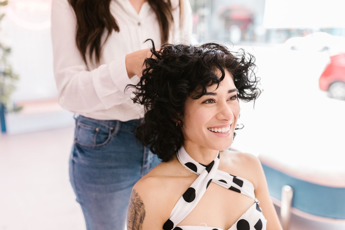 16 Best Haircuts for Curly Hair That Actually Work With Your Curls (2026 Guide) Deva cut curly hair styling at salon