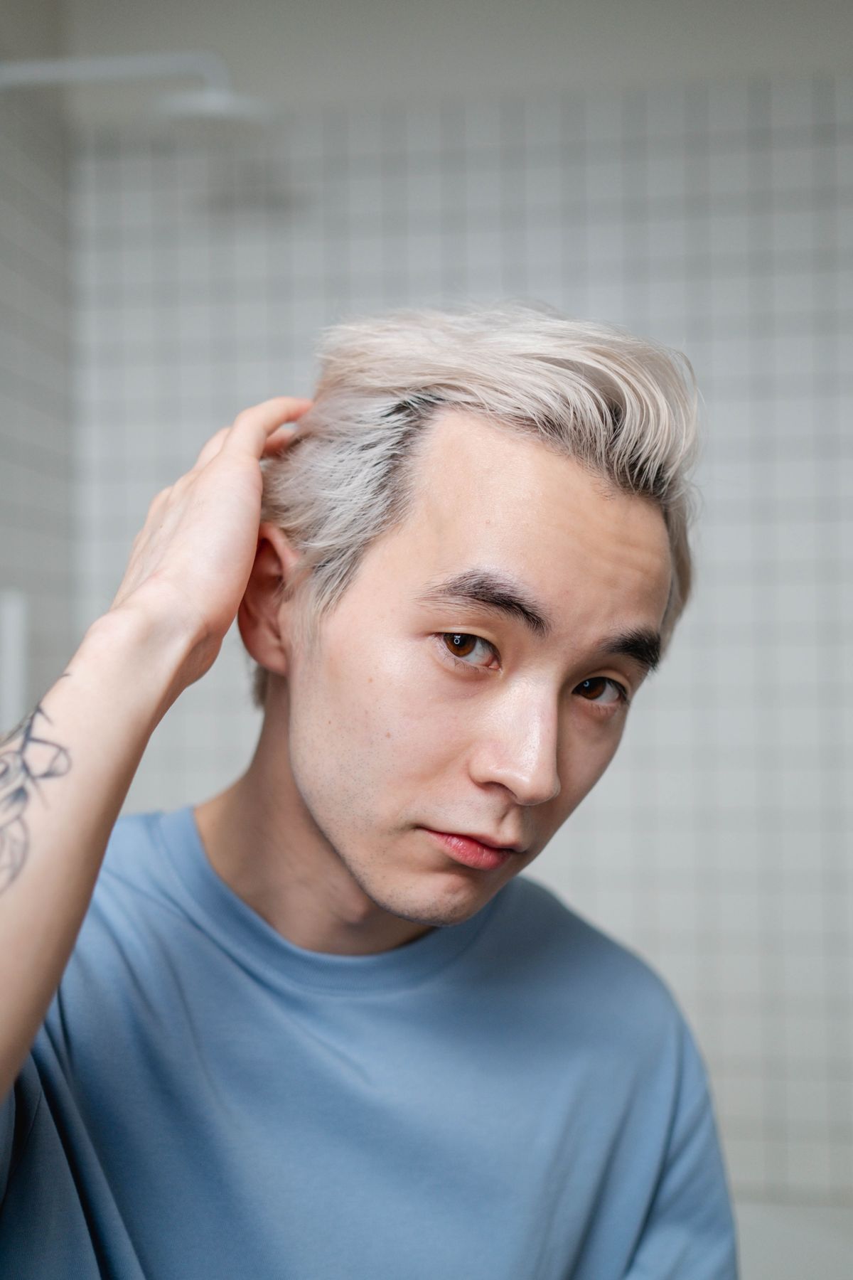 16 Trendy Asian Men Hairstyles (2026 Guide) Platinum blonde textured hairstyle for asian men