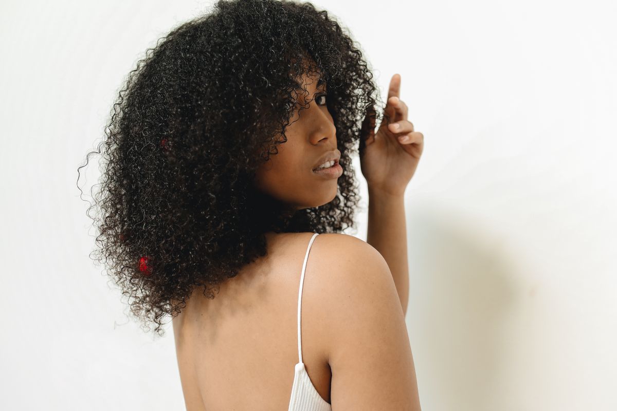 16 Best Haircuts for Curly Hair That Actually Work With Your Curls (2026 Guide) Curly shag haircut back view for curly hair