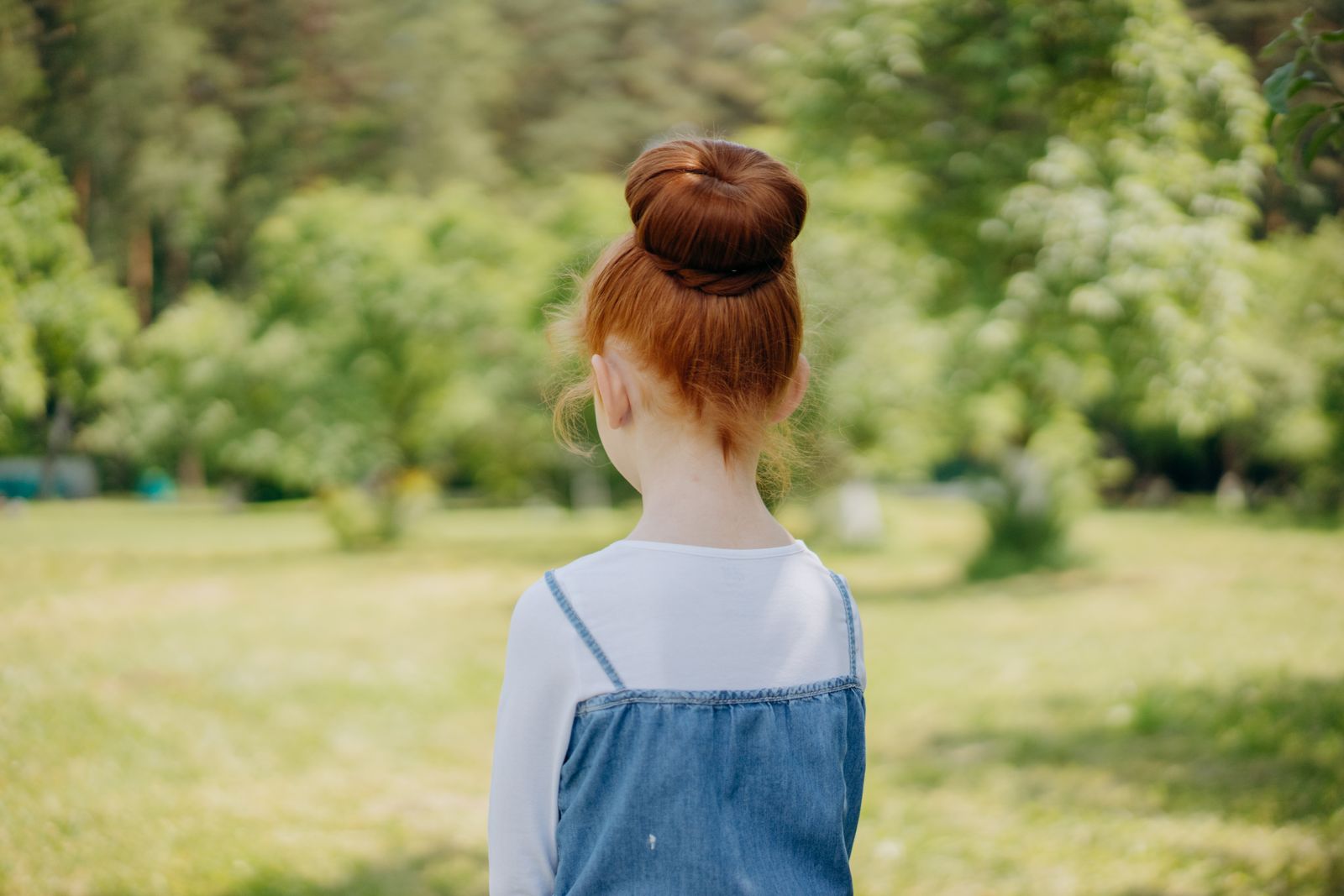 20 Adorable Halloween Hairstyles for Kids to Try Mini witch hat top knot — halloween hairstyle for kids